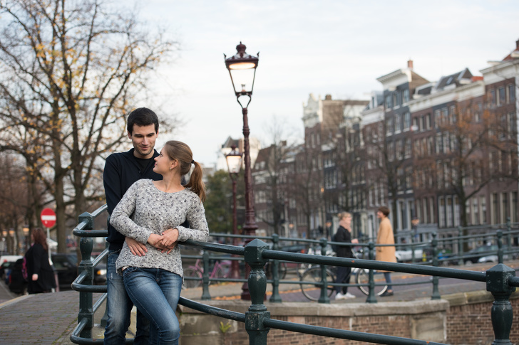 young couple, man and woman in Amsterdam, Netherlands, sightseeing and hugging