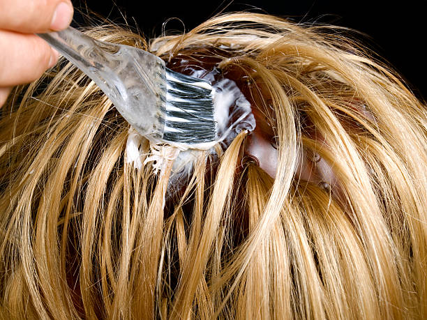 Closeup view during  hair dyeing  treatment ...